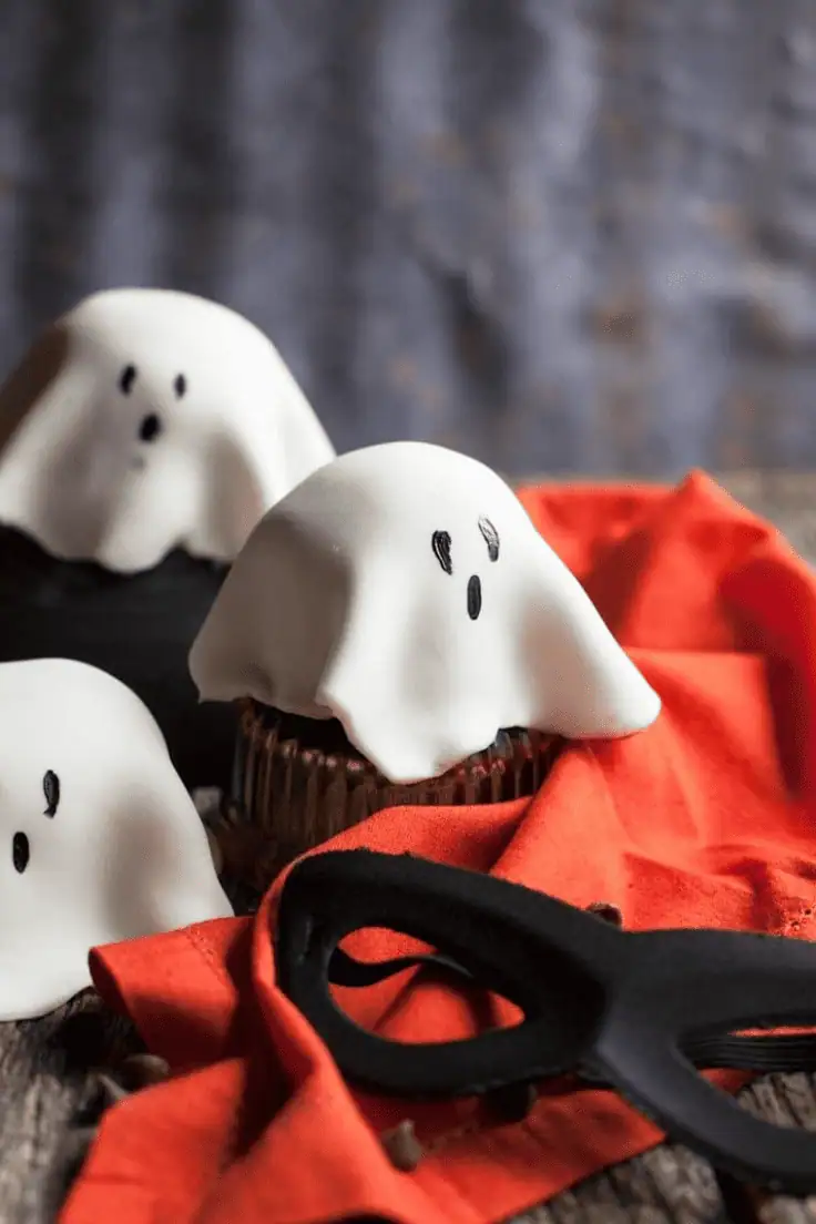chocolate cupcakes with sheet ghosts icing