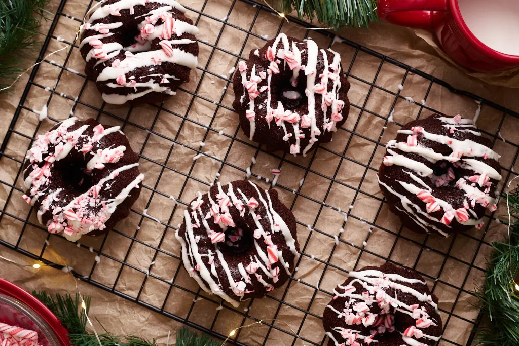 Overhead view of Chocolate peppermint mini bundt cakes on a wire cooling rack.