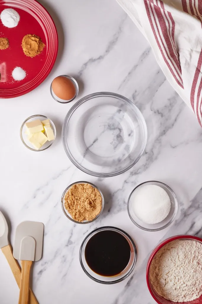 Gingerbread pudding cakes on a marble countertop.