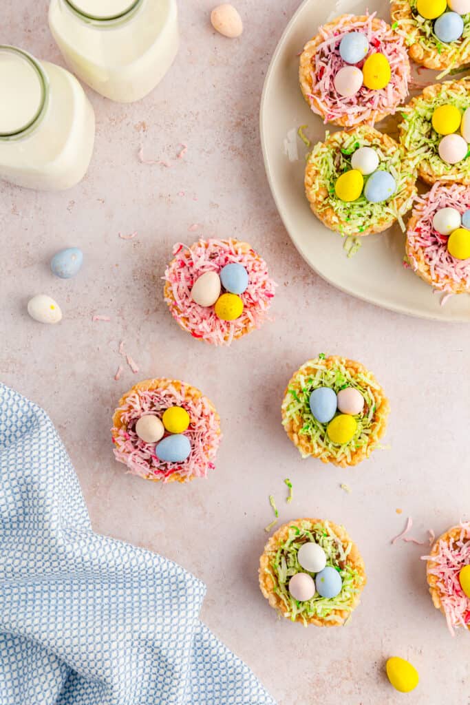 a display arrangement of  easter rice krispies nests with green and pink coconut grass