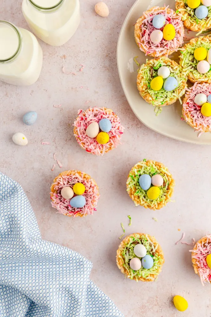 a display arrangement of easter rice krispies nests with green and pink coconut grass