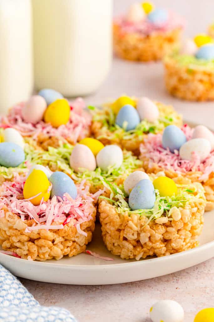 side view of easter rice krispies nests with green and pink coconut grass