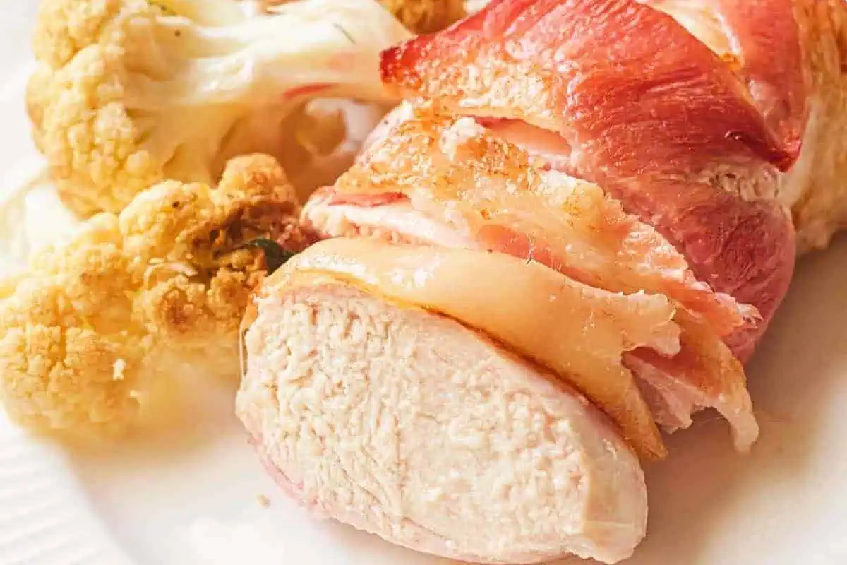 A bacon wrapped chicken breast.