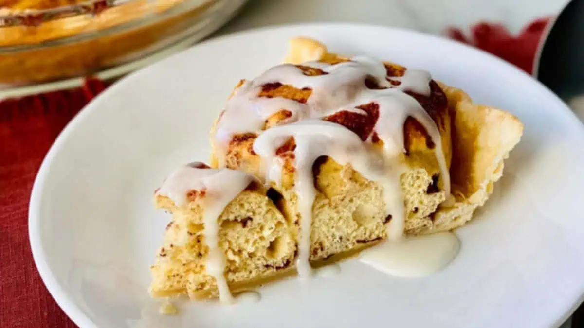 A slice of cinnamon roll pie on a plate.