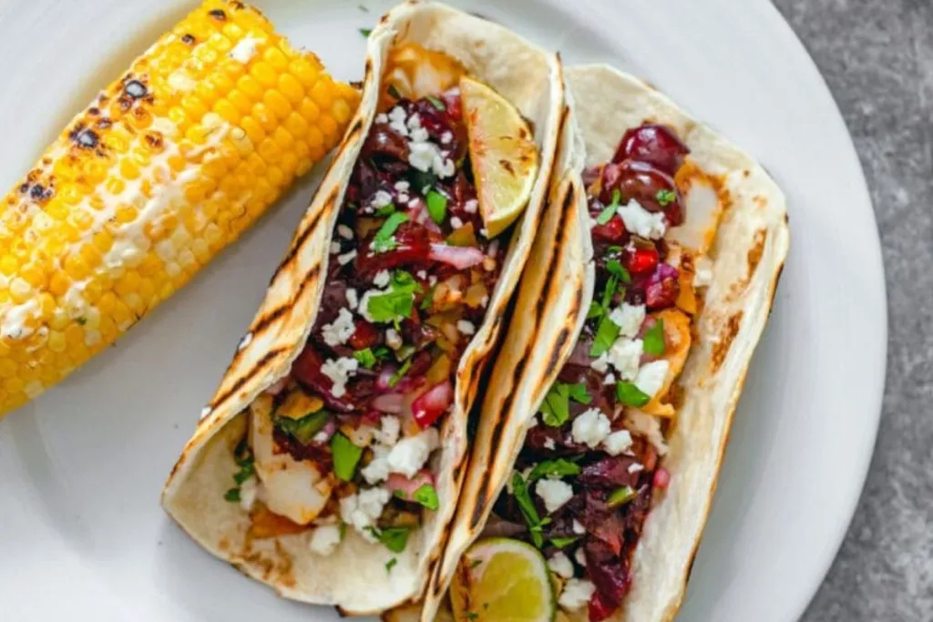 Fish tacos topped with grilled cherry salsa.
