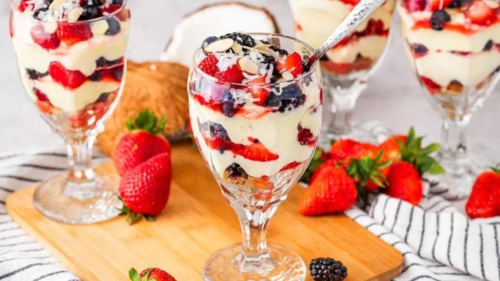 Parfaits of berries, cream and vanilla cookies.