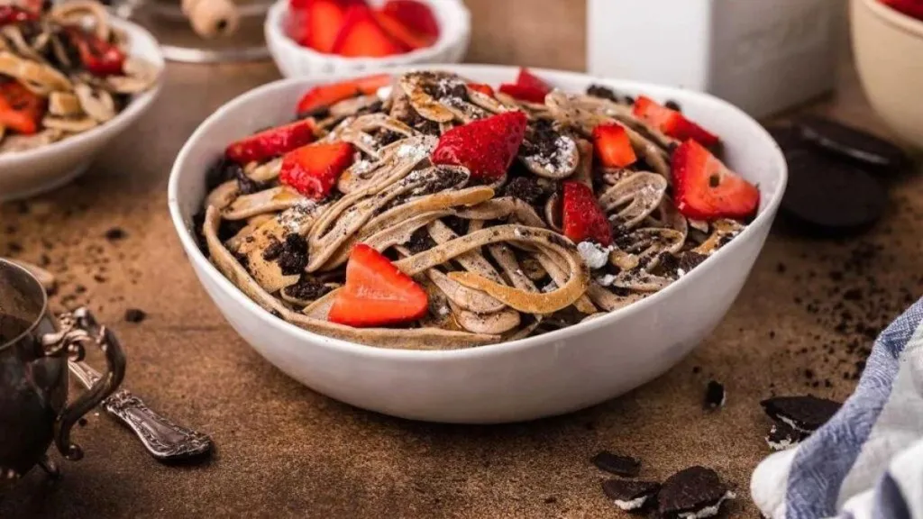 A bowl of pancakes cut into stips like noodles.