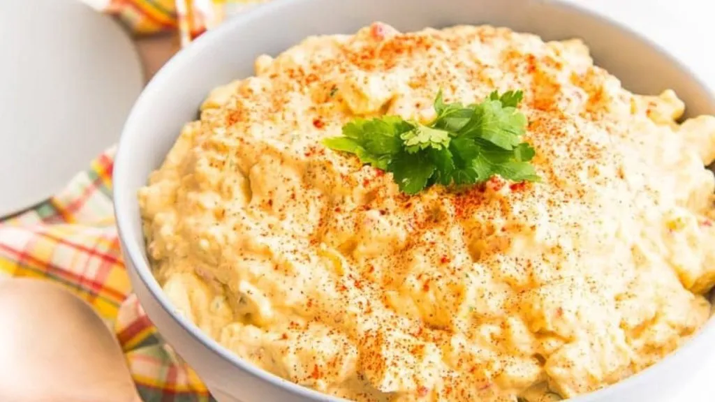 A dish of homemade potato salad in a bowl.