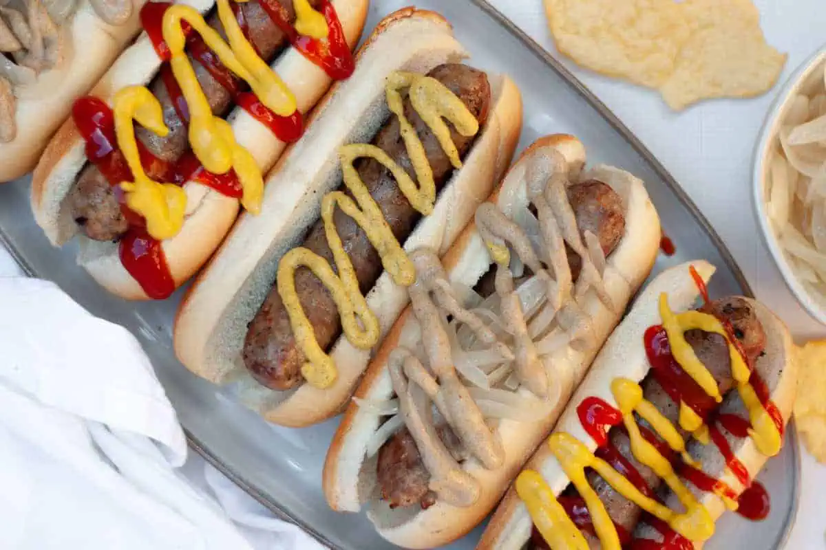 Beer brats with toppings.