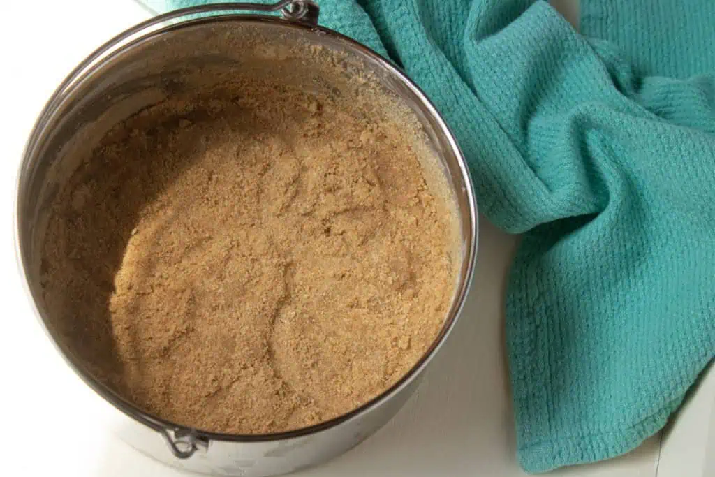 6-inch push pan with cheesecake crust pushed onto the bottom and 1/2 way up the sides.