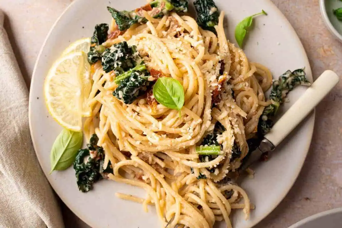 Creamy cavolo nero pasta on a plate.