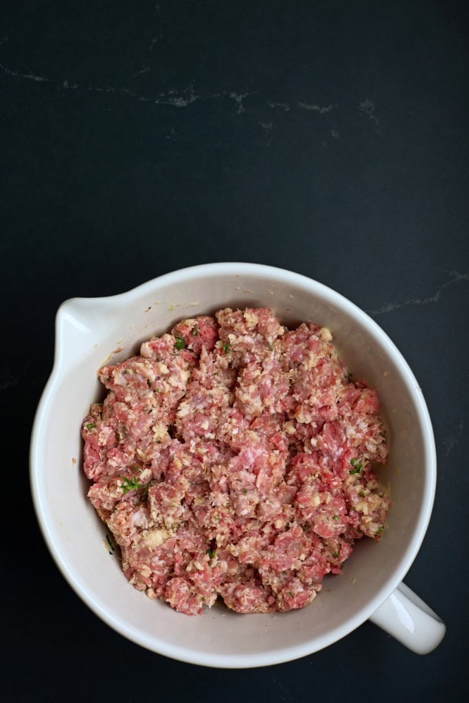 Large mixing bowl with meatball mixture, chilled and ready to be formed into balls.