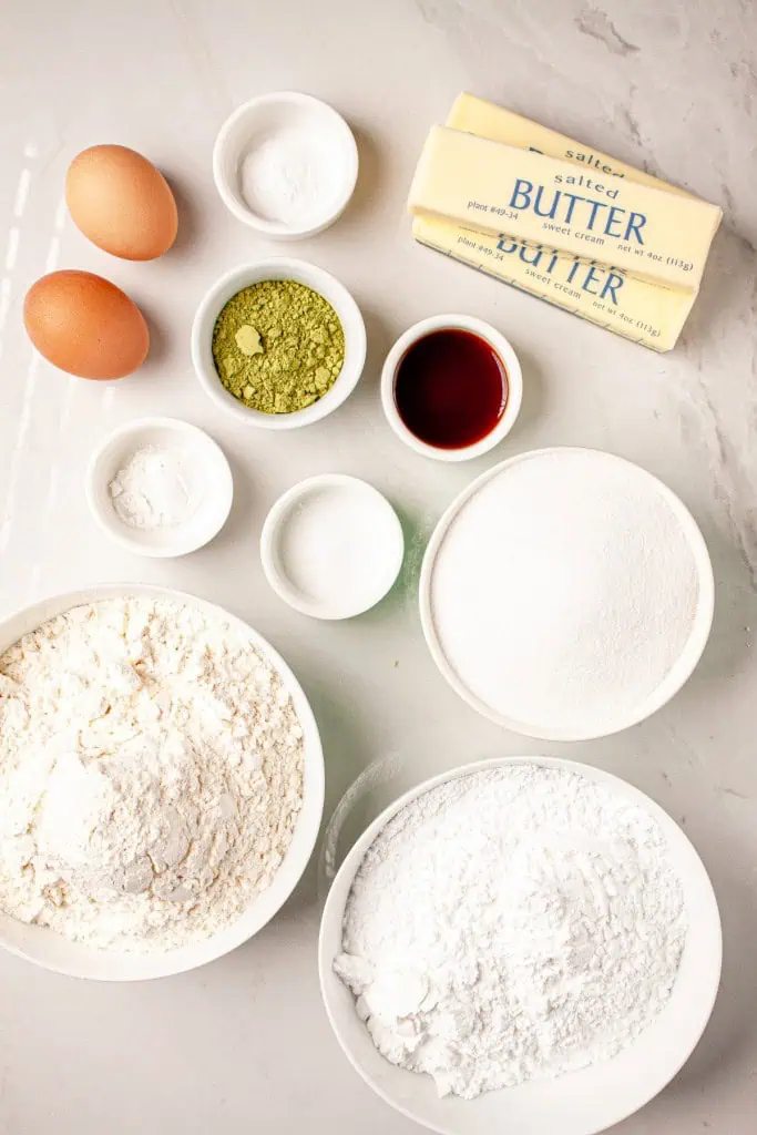 All the necessary ingredients needed to make match cream filled cookie sandwiches