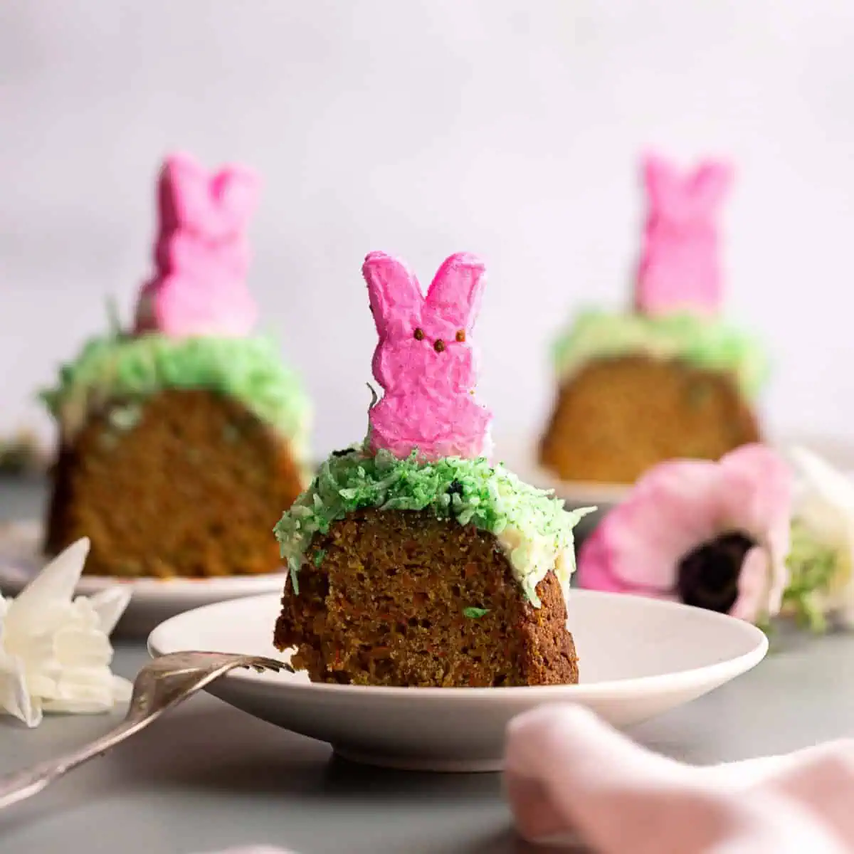 main image for peeps carrot bundt cake easter dessert with pink rabbit peeps on top