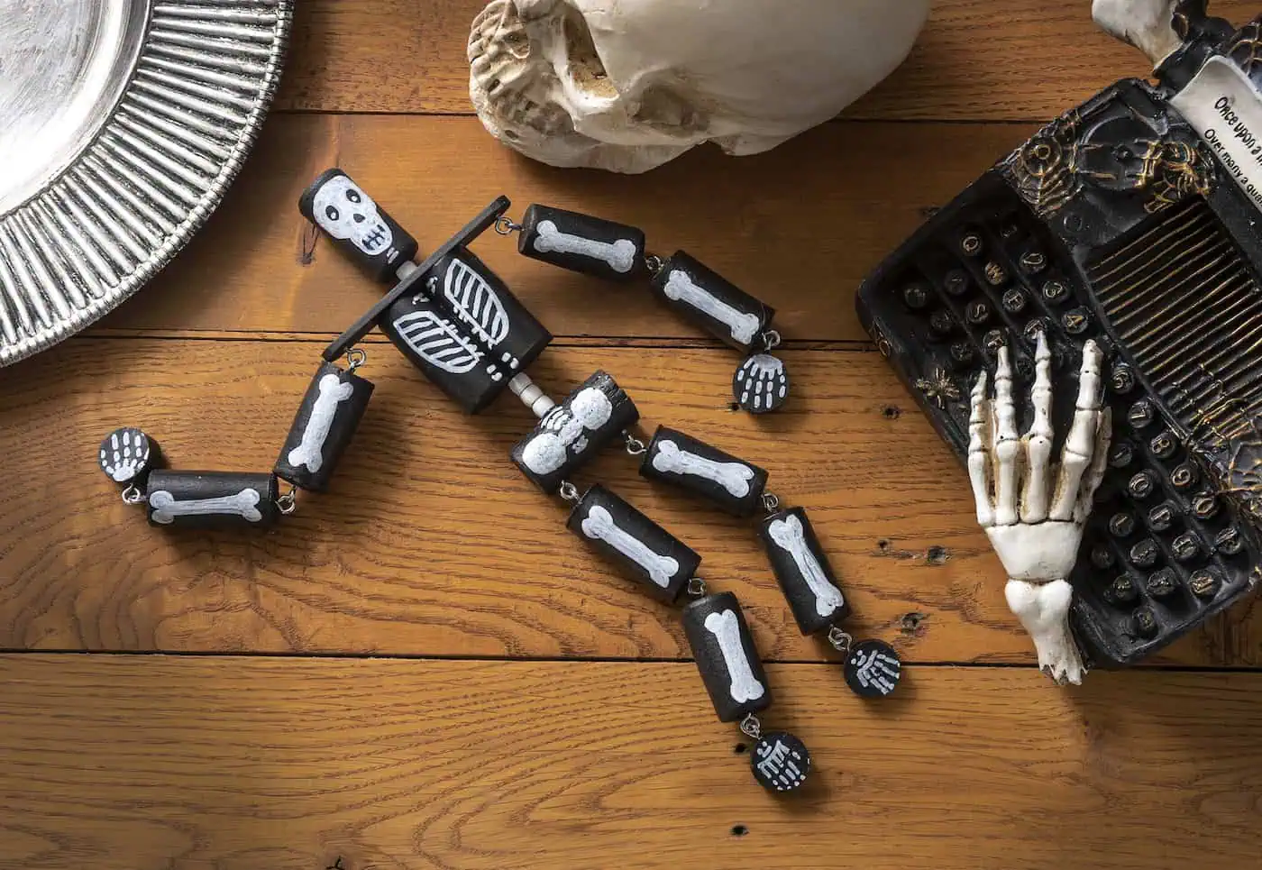 a black and white hand painted skeleton diy wine cork halloween project