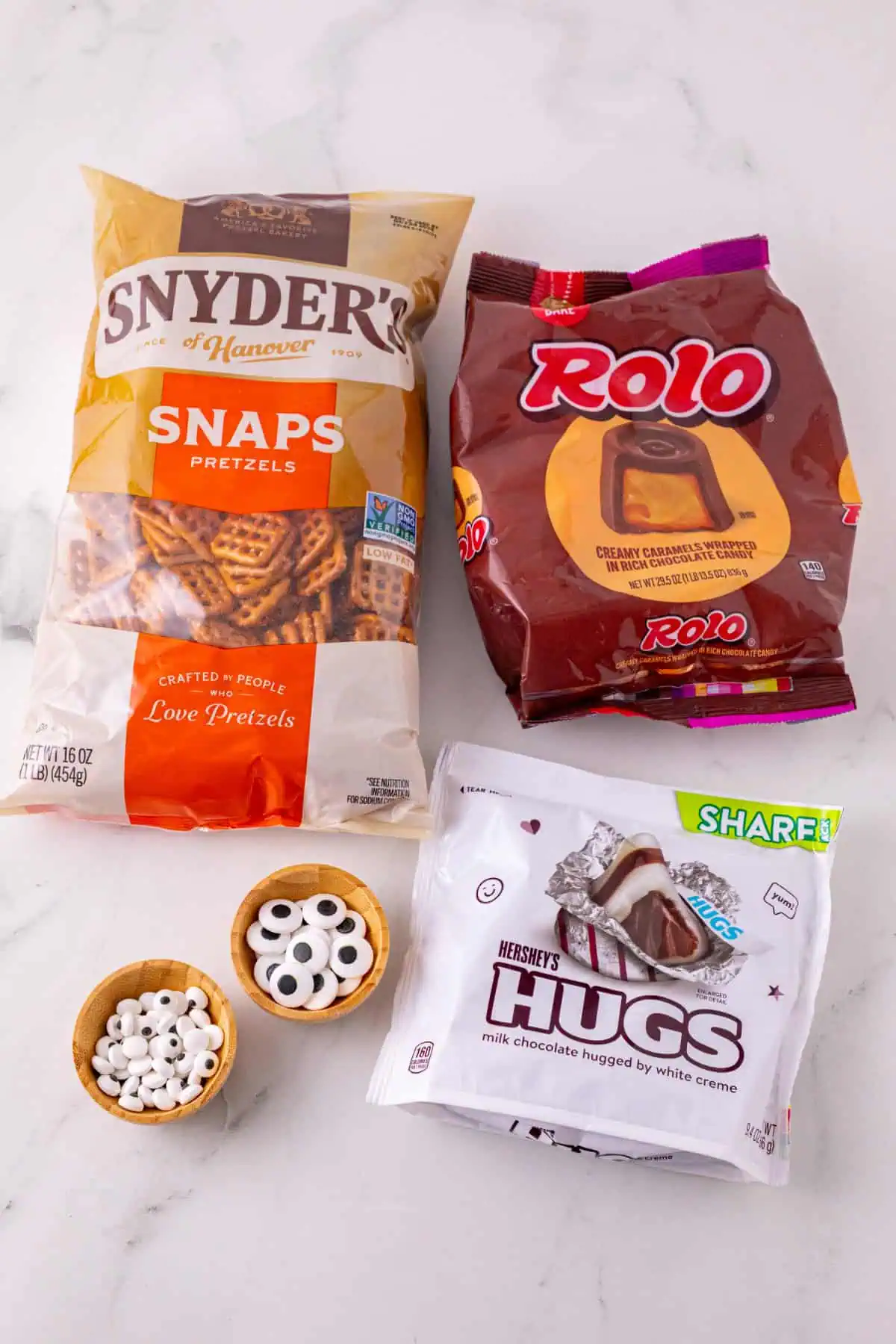 Pretzel snaps, unwrapped Rolos, Hershey’s Hugs, and large and small candy eyes.